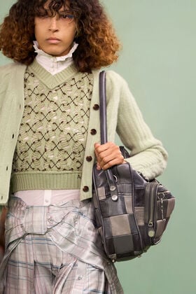 Model walking the runway at the Acne Studios FW26 Paris Fashion Show, announcing the Women’s Fall/Winter 2026 collection.