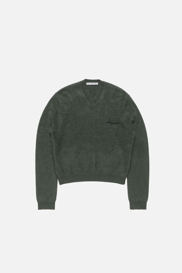 Acne Studios dark green cashmere v-neck sweater with fuzzy texture, embroidered logo at chest, ribbed cuffs and hem, regular fit.