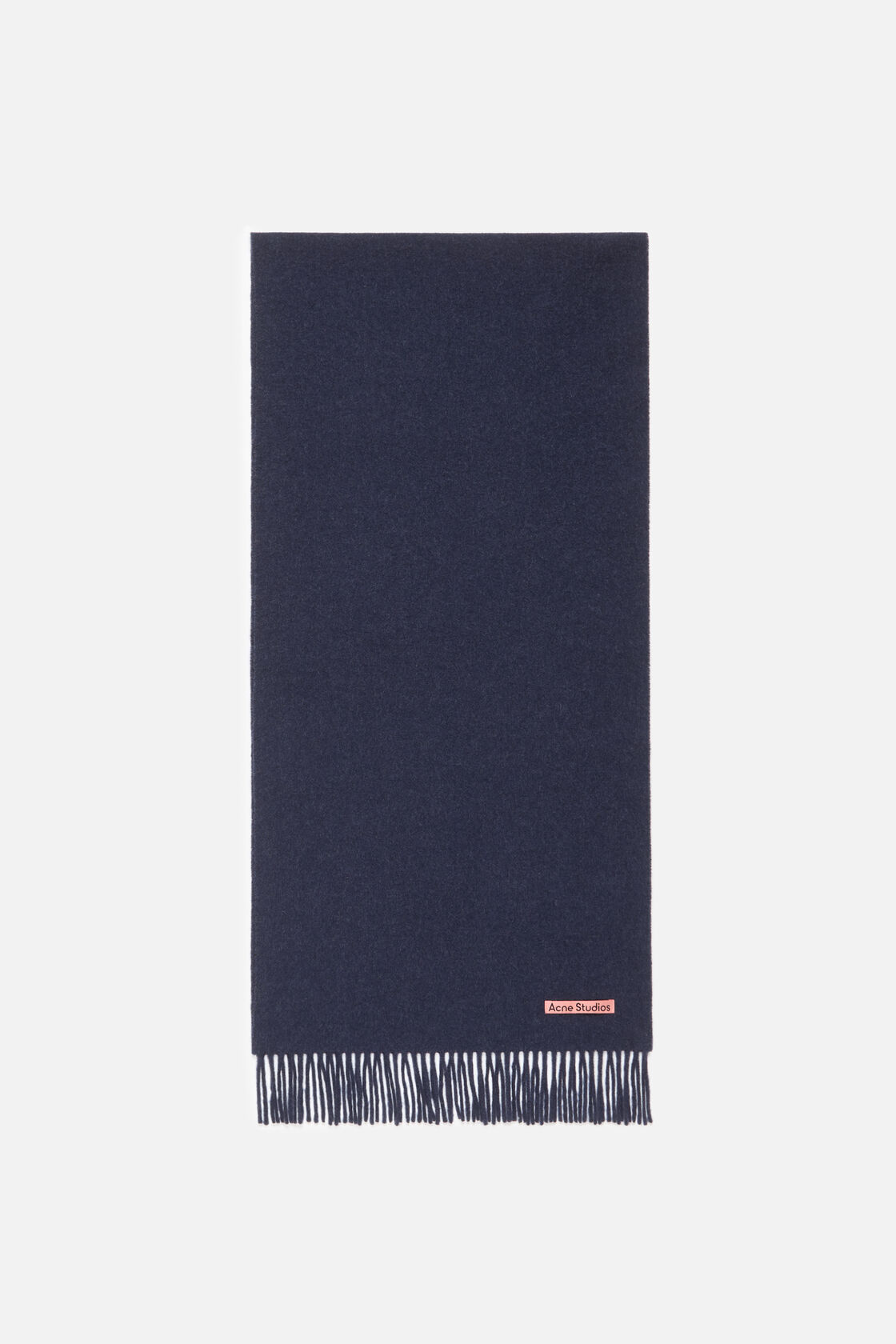 Acne Studios narrow fringe wool scarf in dark navy melange, displayed flat with fringe along the bottom edge and a small pink logo label.