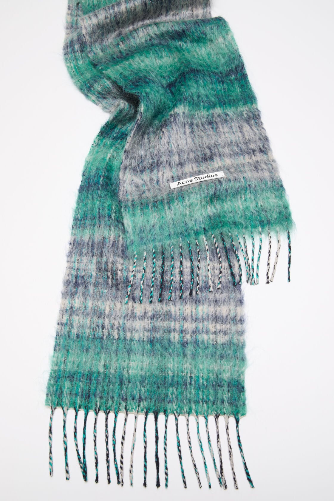 Acne Studios fringed mohair scarf in white and aqua striped pattern with twisted fringe ends and woven logo label.