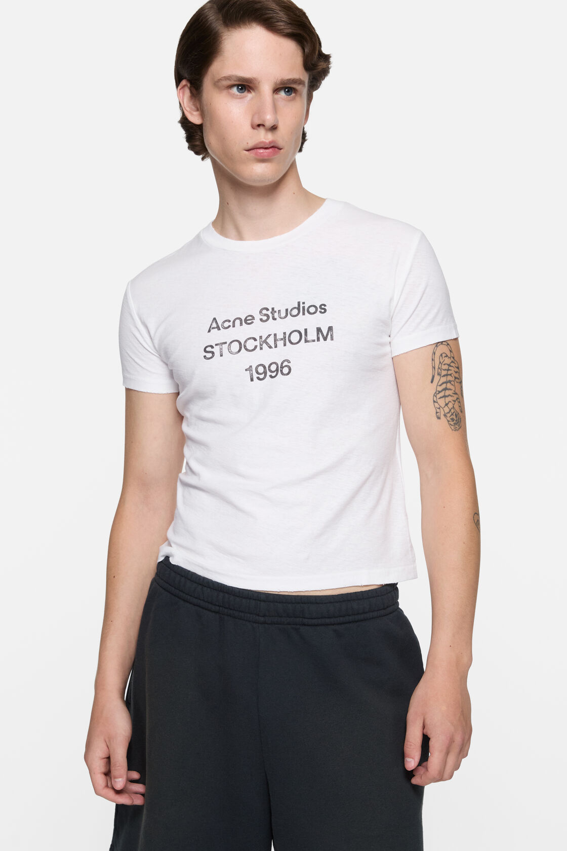 Acne Studios off-white logo T-shirt in cotton-hemp blend, featuring printed Stockholm 1996 text on the chest, crew neck, regular fit.