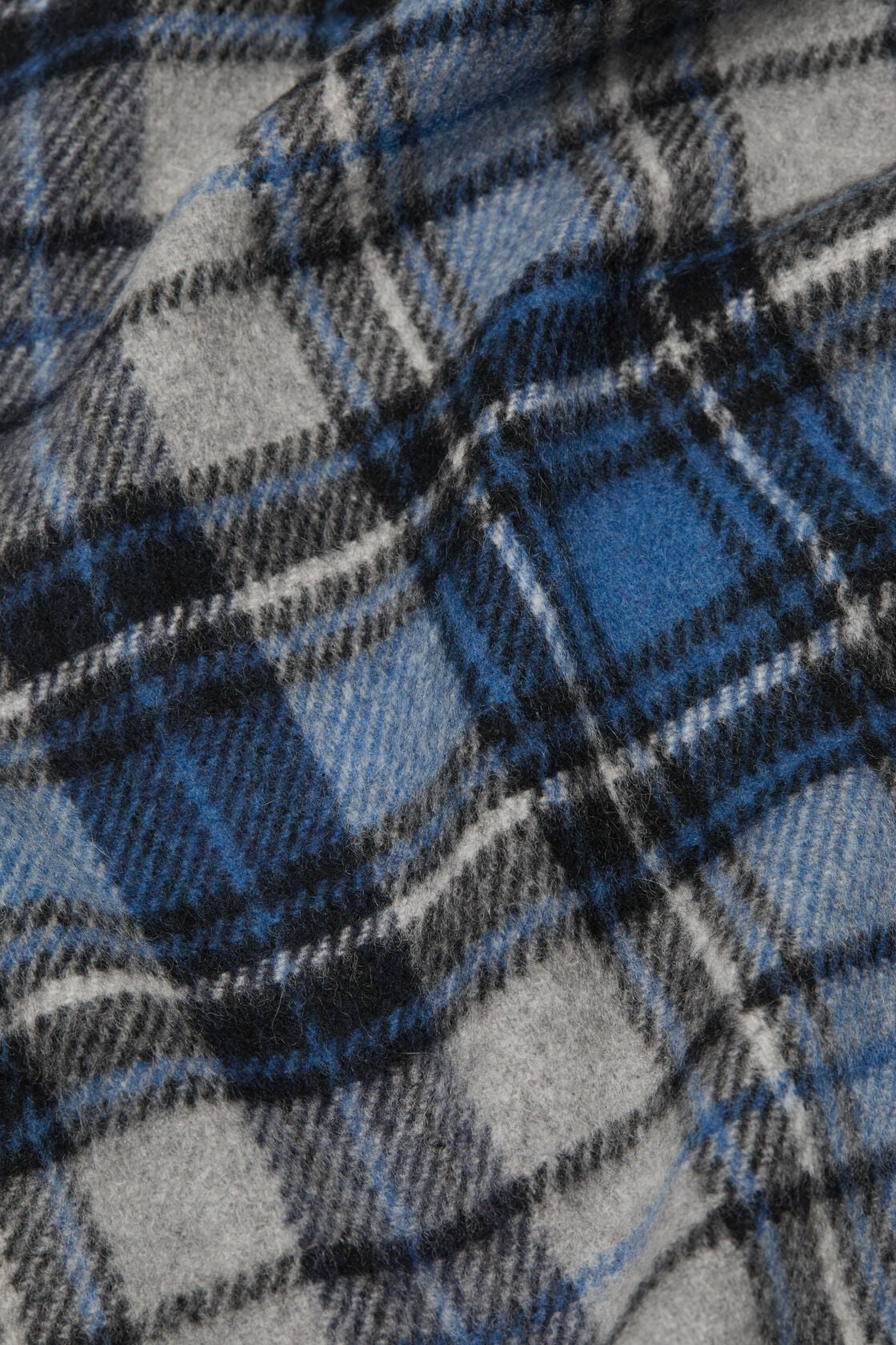 Close-up of an Acne Studios blue and grey cashmere scarf featuring a tartan check pattern with black and white accents.