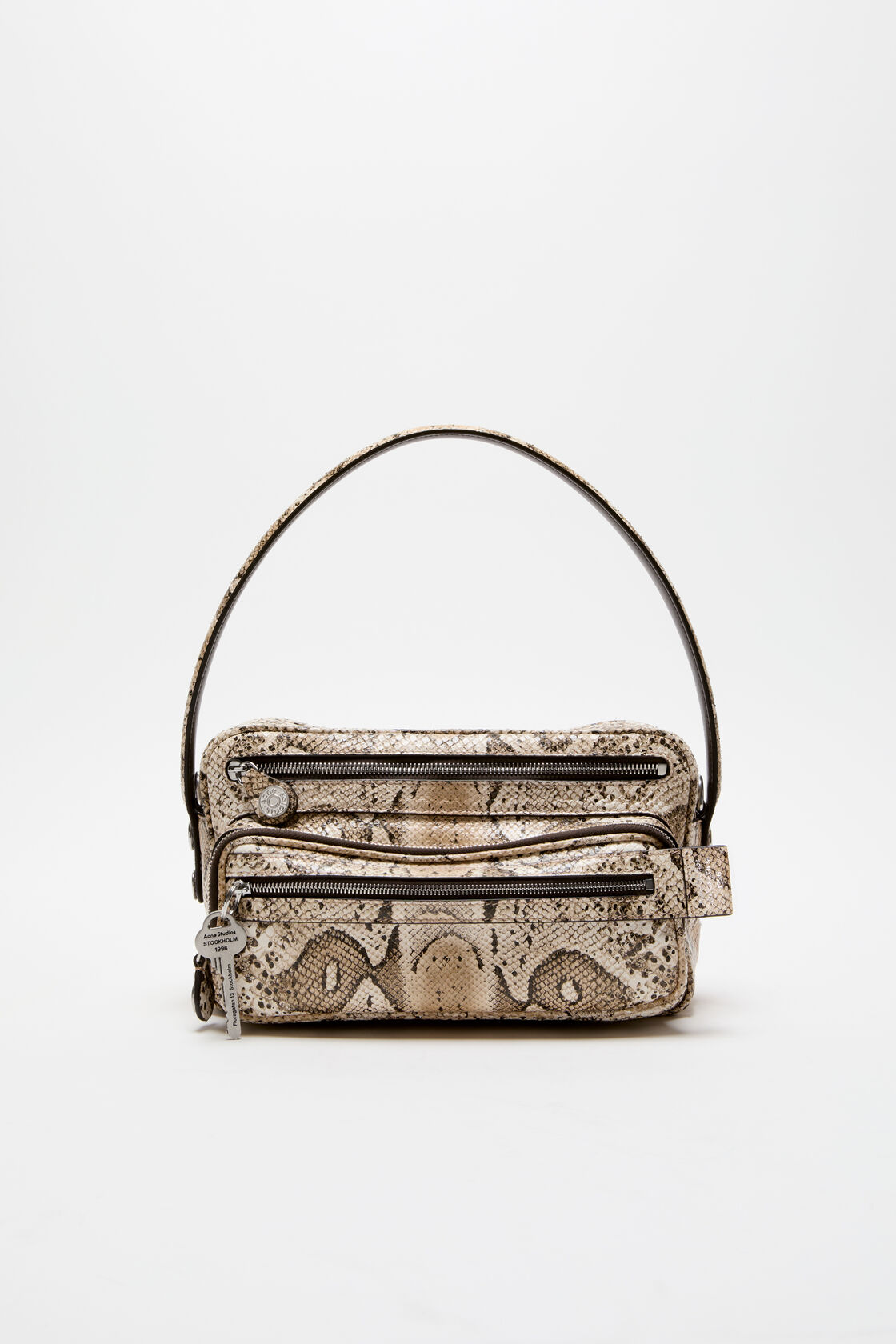 Acne Studios shoulder bag in beige multi snake-print leather with two zip compartments, silver-tone hardware, and a slim top handle.