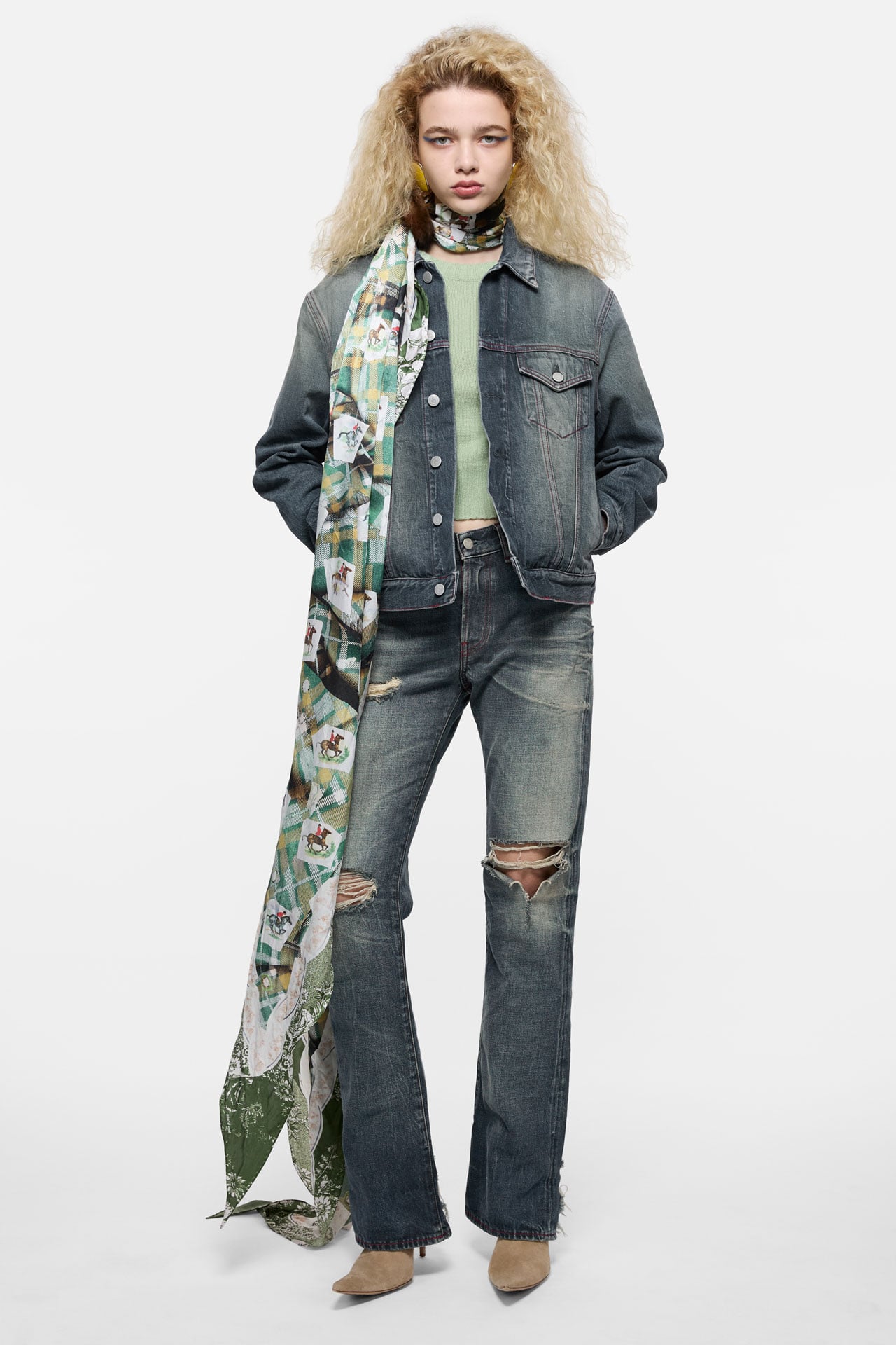 Acne Studios Womenswear 30 Years collection denim jacket and ripped jeans, green t-shirt and green printed silk scarf.