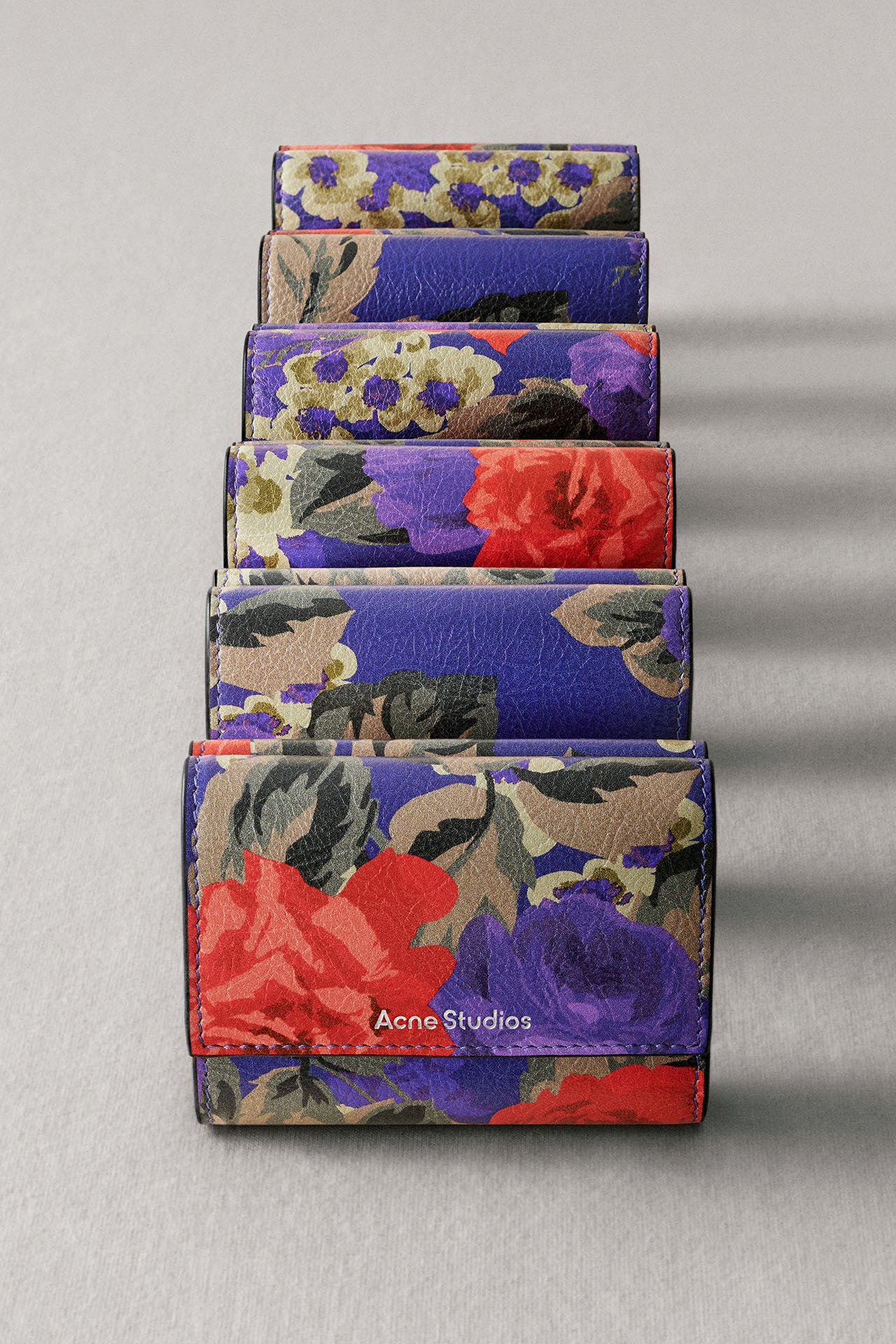 A creative showcase of the Japanese Super Lucky Day bag collection in purple and orange colors.