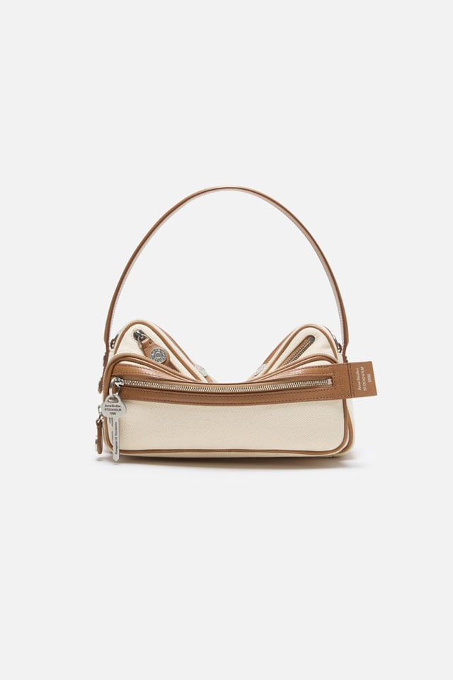 A showcase of the product: Acne Studios FW26 New Arrivals taupe canvas Camero bag.