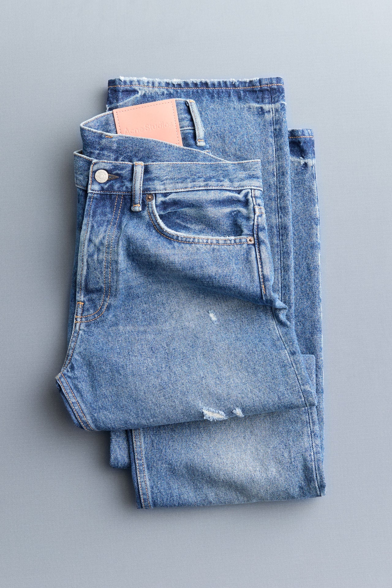 Acne Studios blue signature jeans folded.