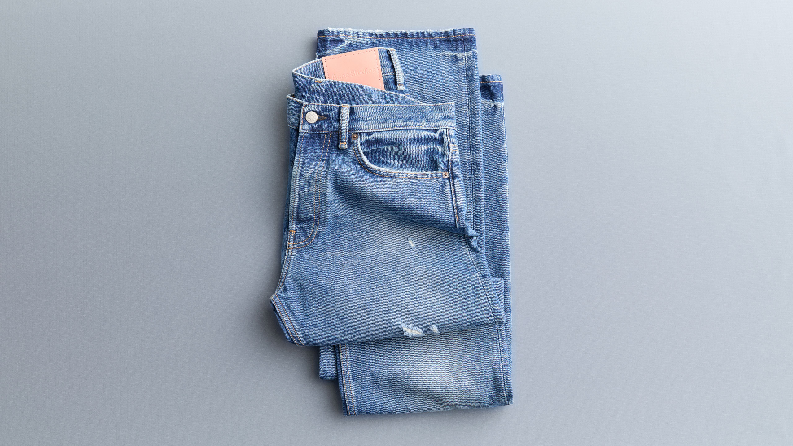 Acne Studios blue signature jeans folded.