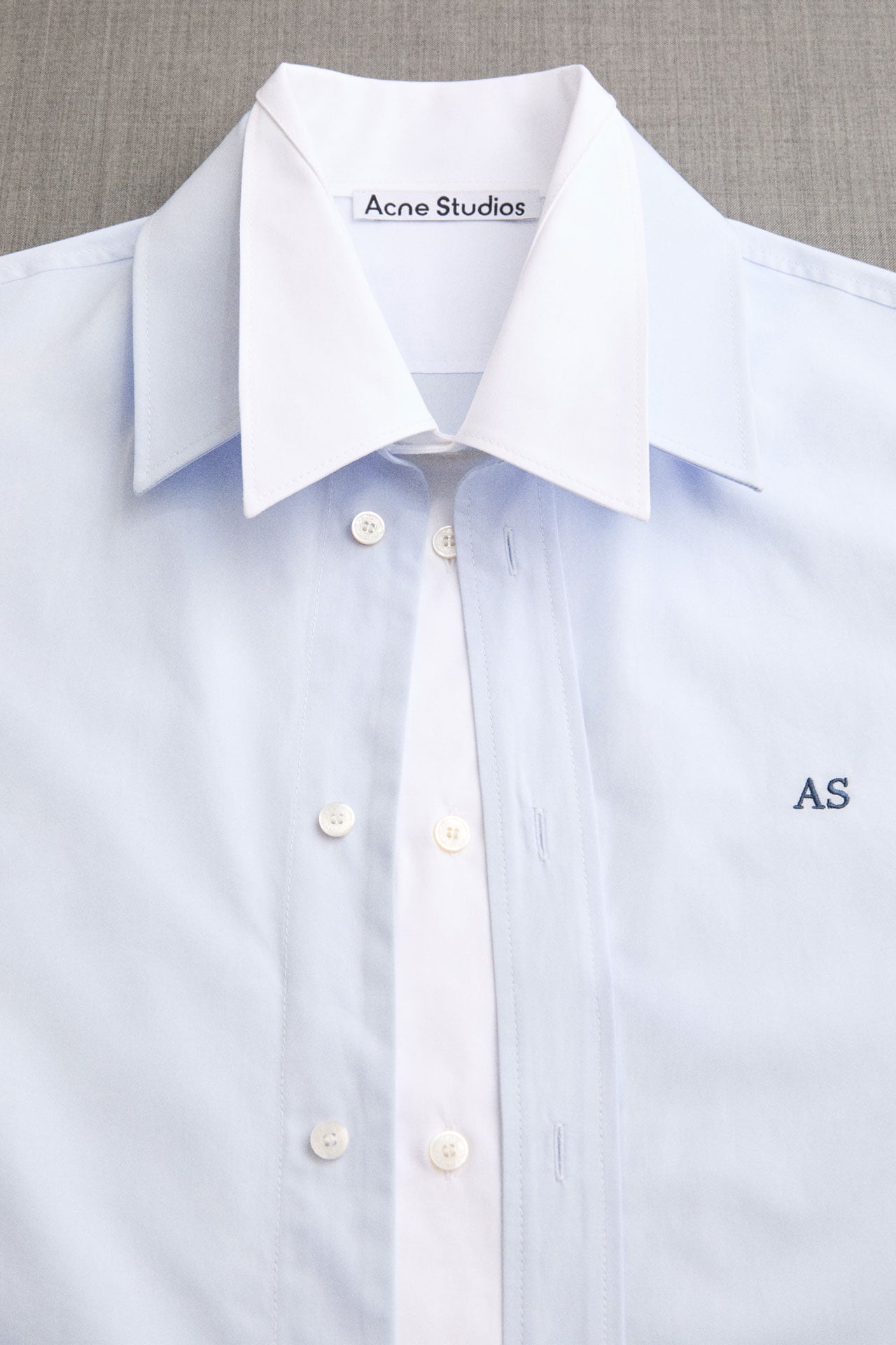 Acne Studios light blue and white shirt close-up.