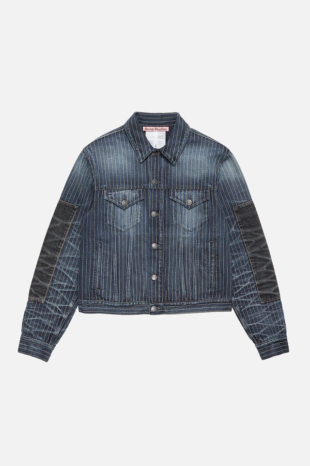 A showcase of the product of Acne Studios patchwork deep blue denim jacket.
