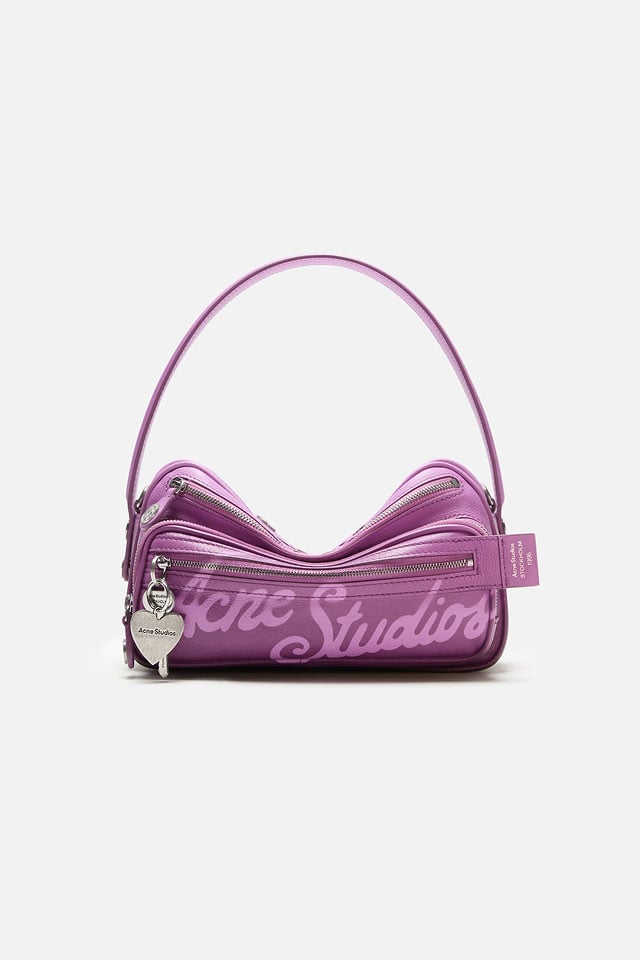 A showcase of the product of Acne Studios pink camero bag with logo pattern.