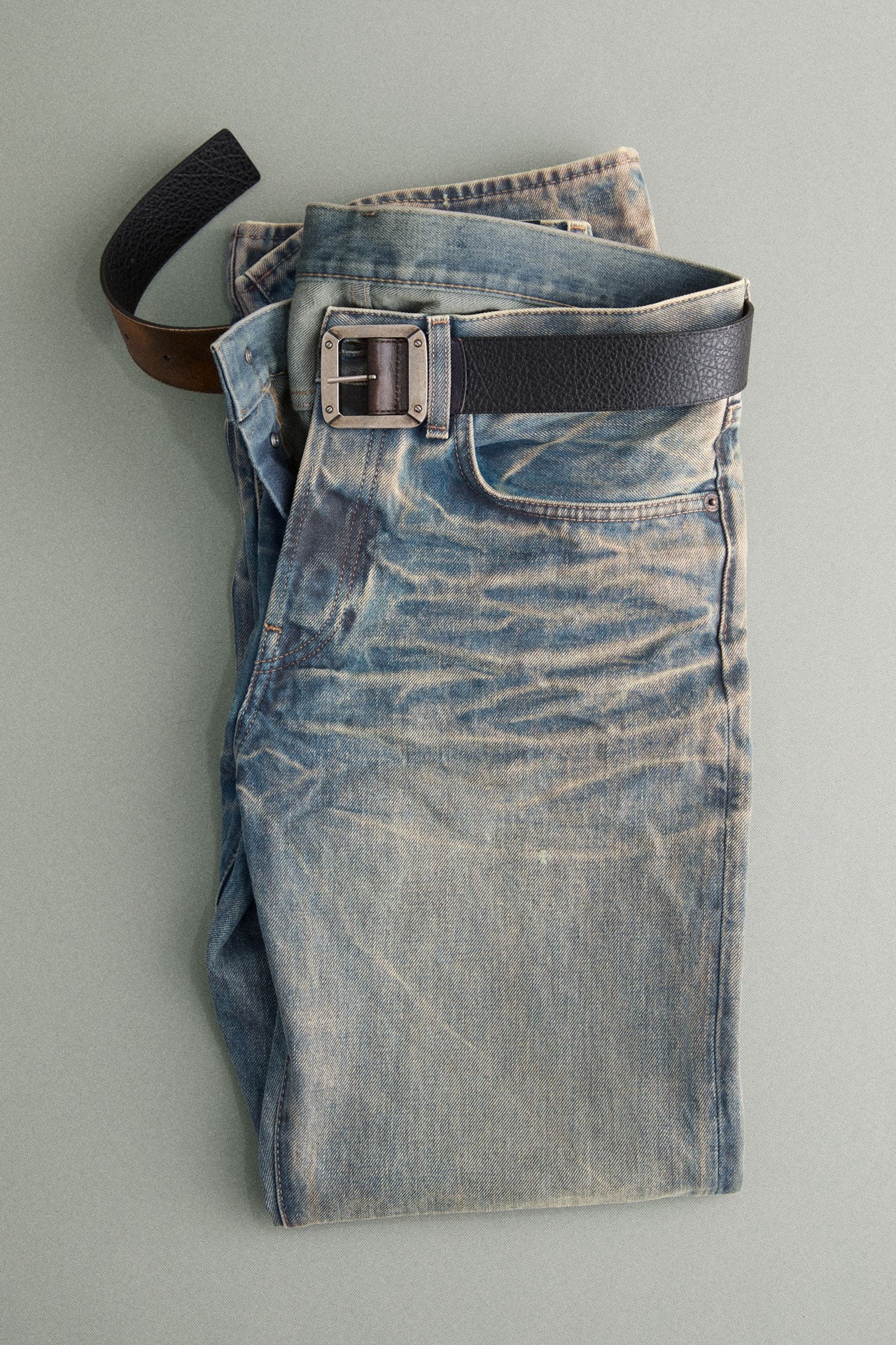 Acne Studios blue worn jeans.