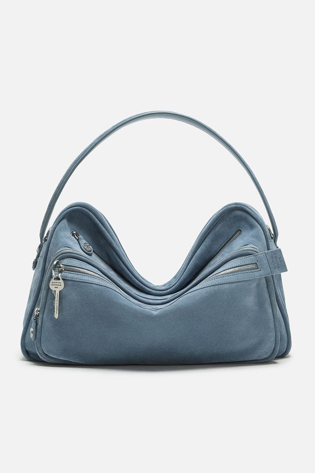 A showcase of Acne Studios Valentines Day collection light blue suede Camero Bag.
