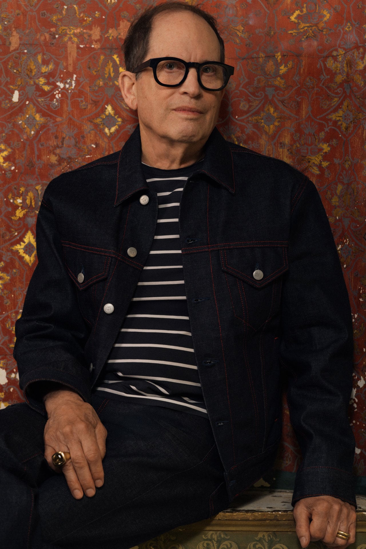 Acne Studios Menswear 30 Years Anniversary dark denim jacket and jeans and striped t-shirt.
