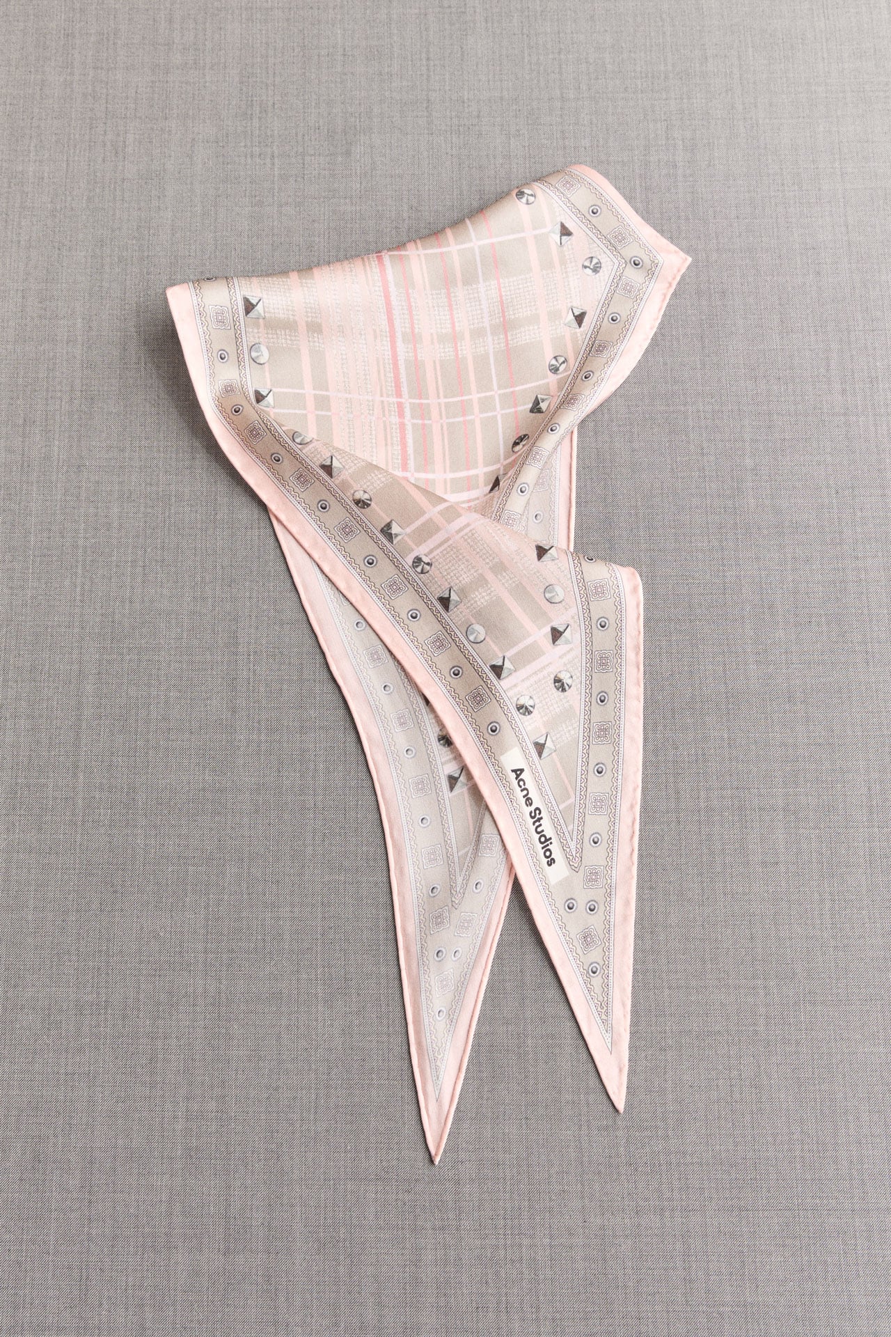 Acne Studios light pink silk scarf.