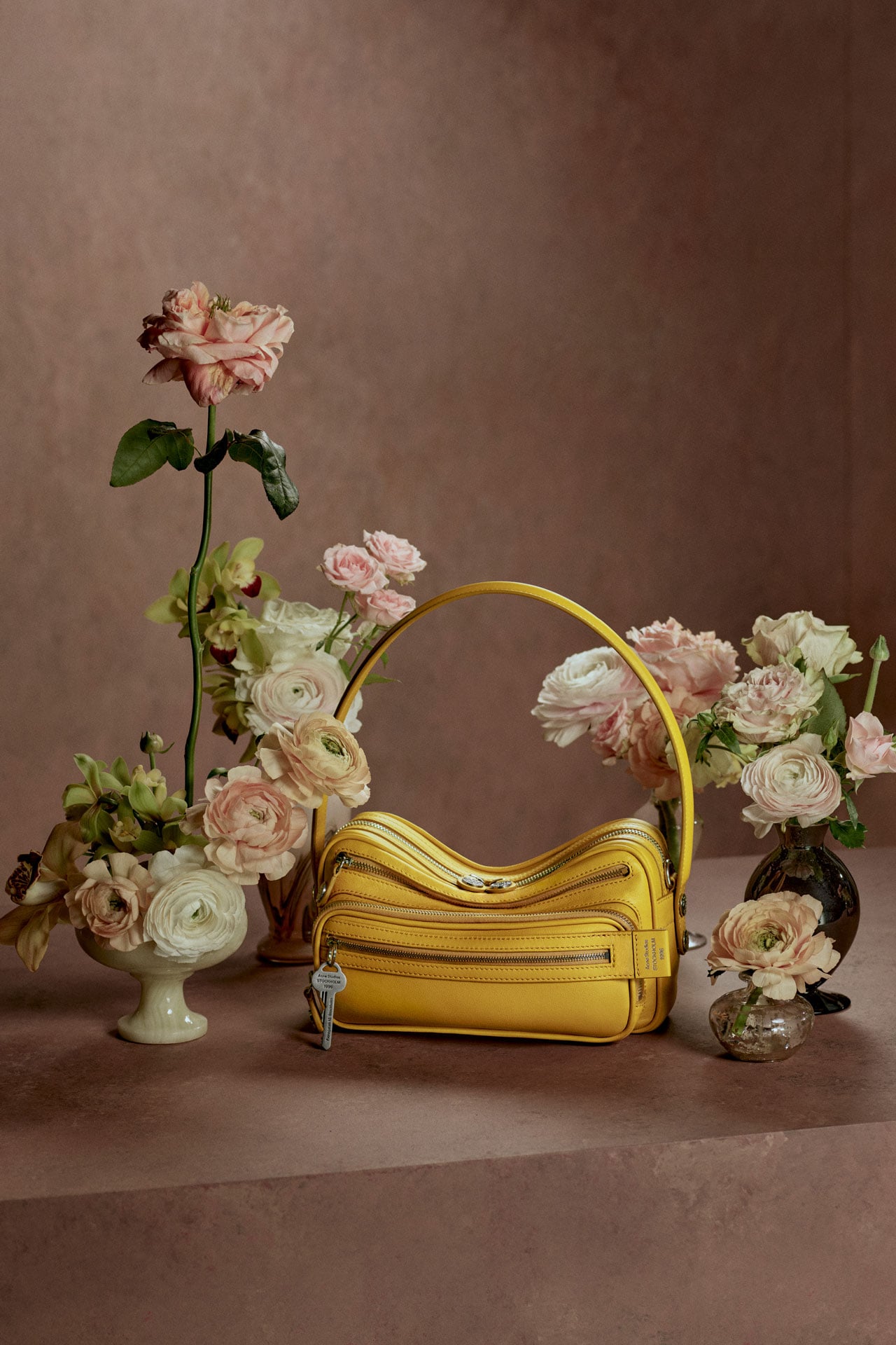 Acne Studios yellow leather Camero bag.