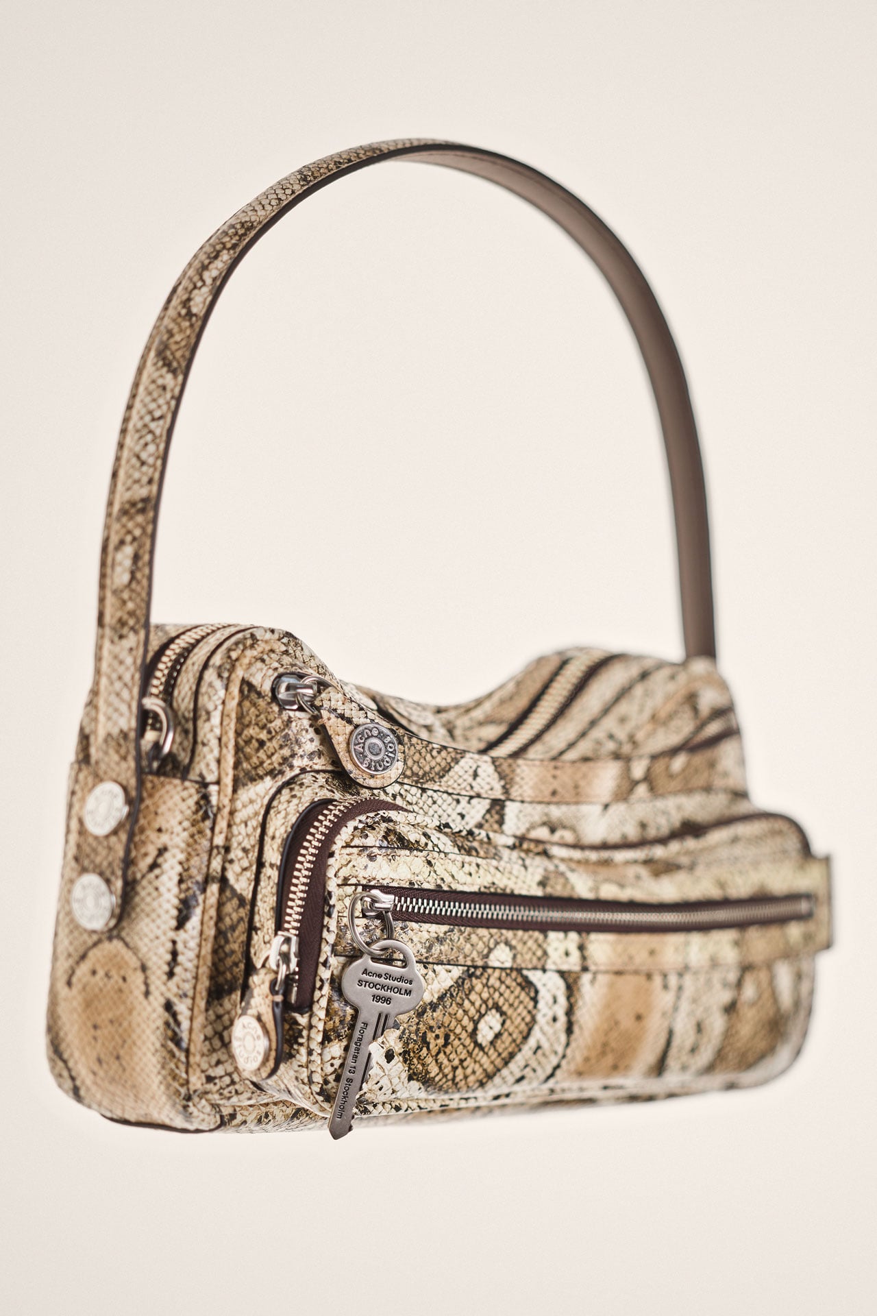 Acne Studios Camero part bag in sneak skin color.