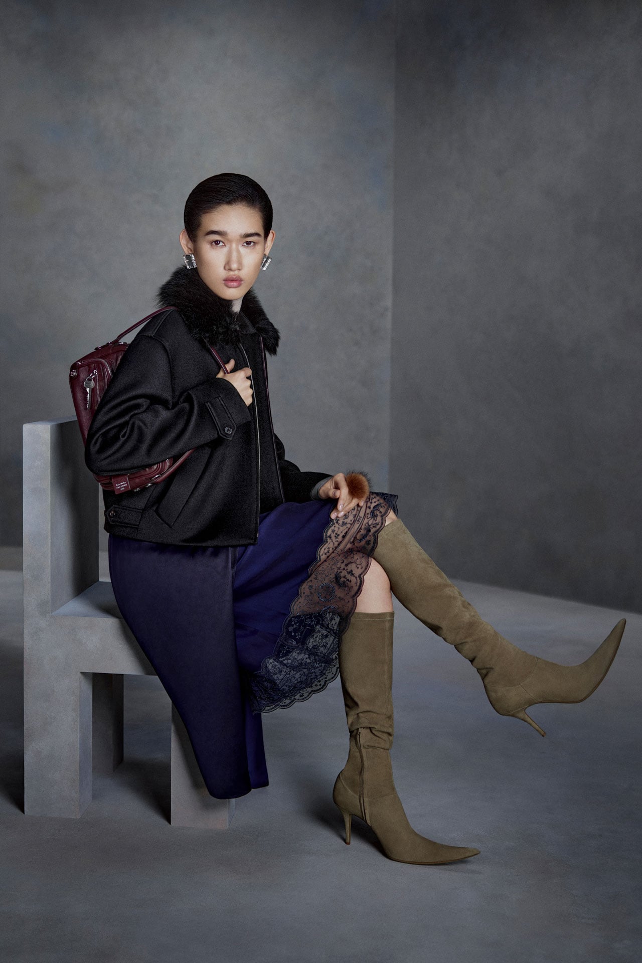Acne Studios FW26 Runway Collection black bomber jacket.