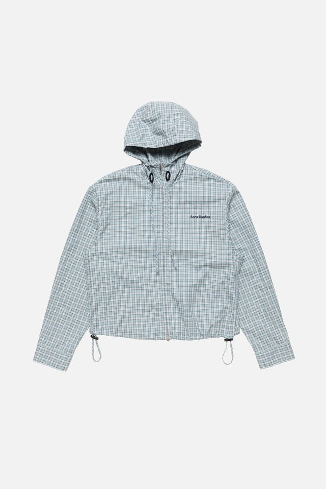 A showcase of the product: Acne Studios blue checked jacket with hood.