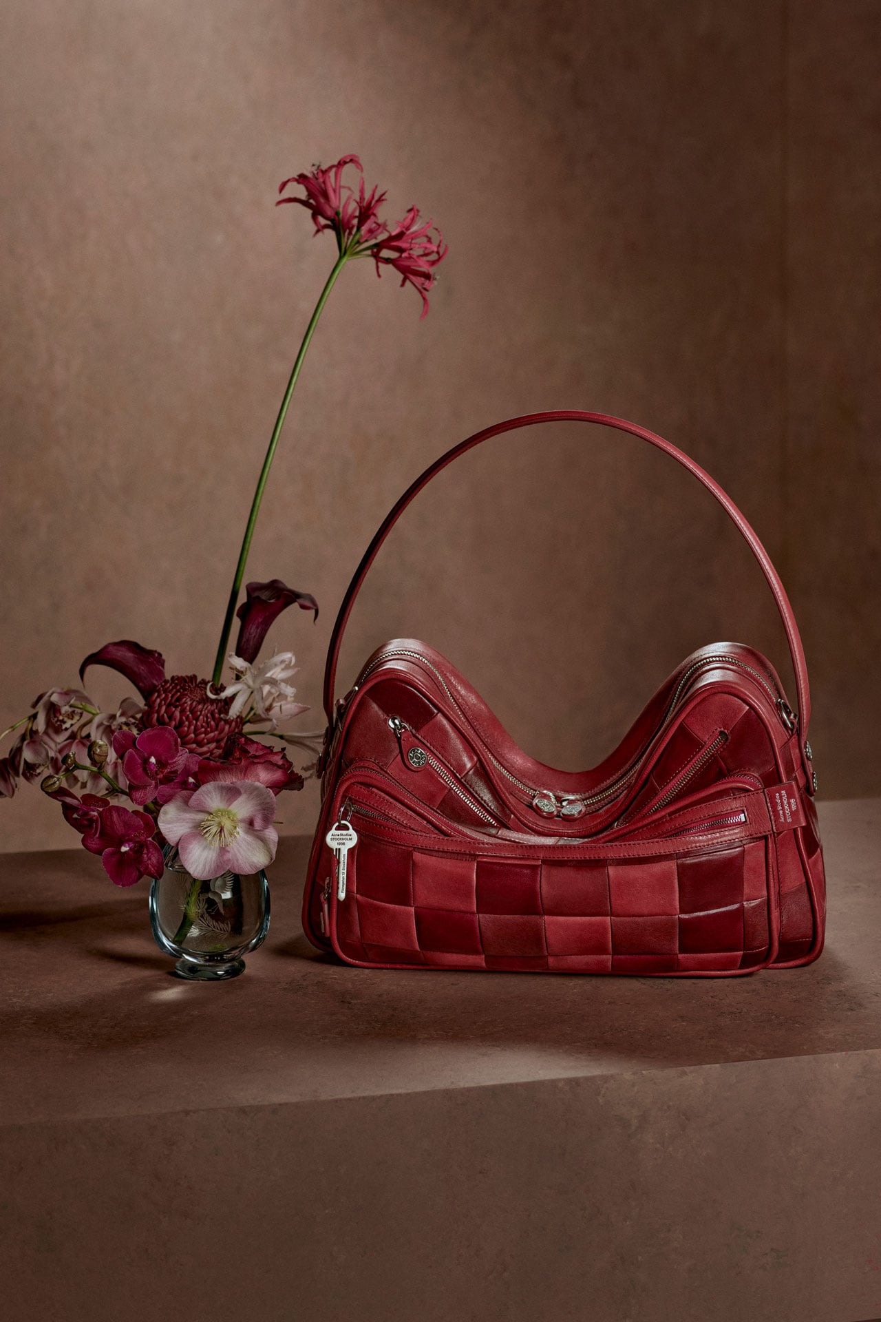 Acne Studios leather Camero bag in red patchwork.