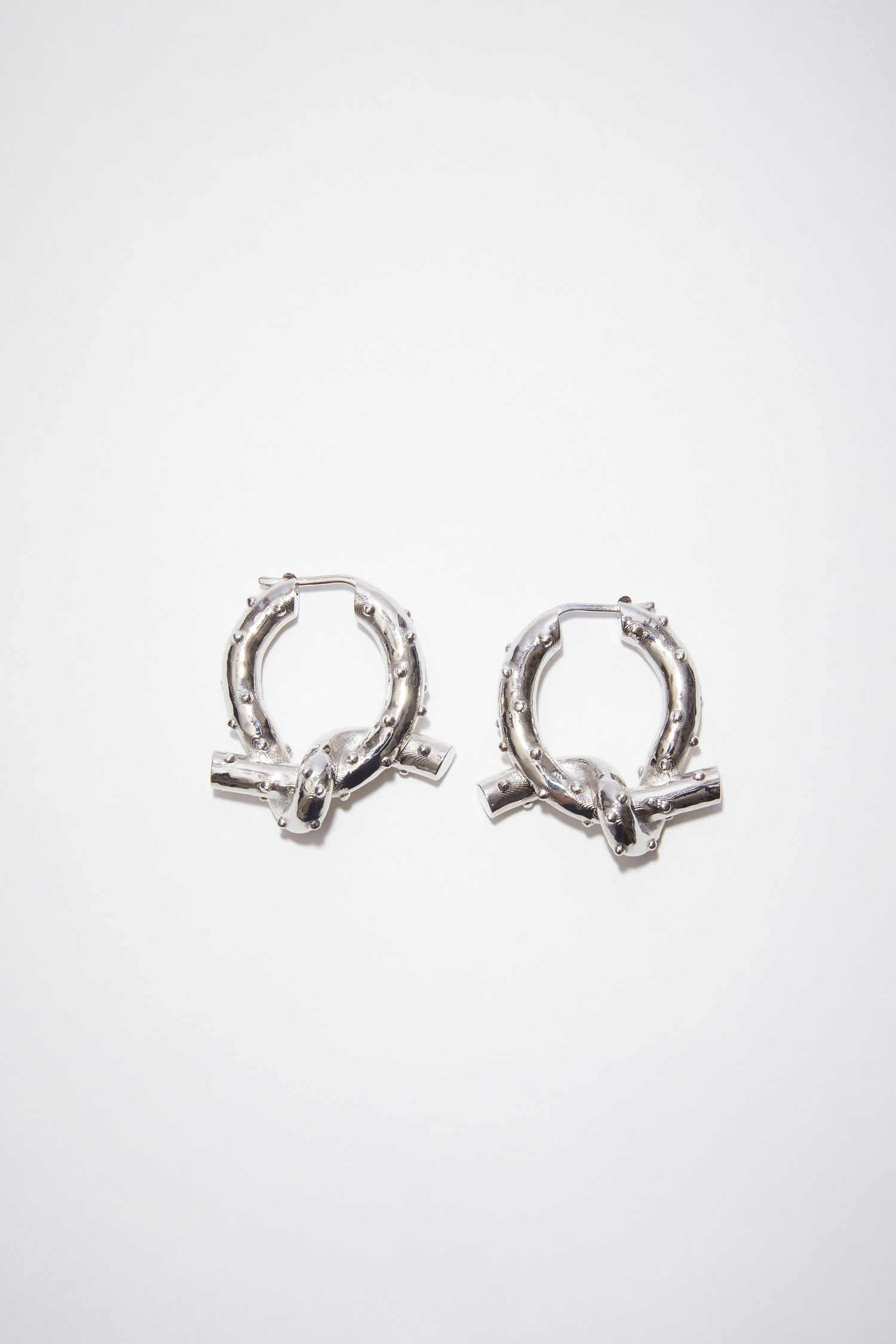 acnestudios.com | Knot earrings
