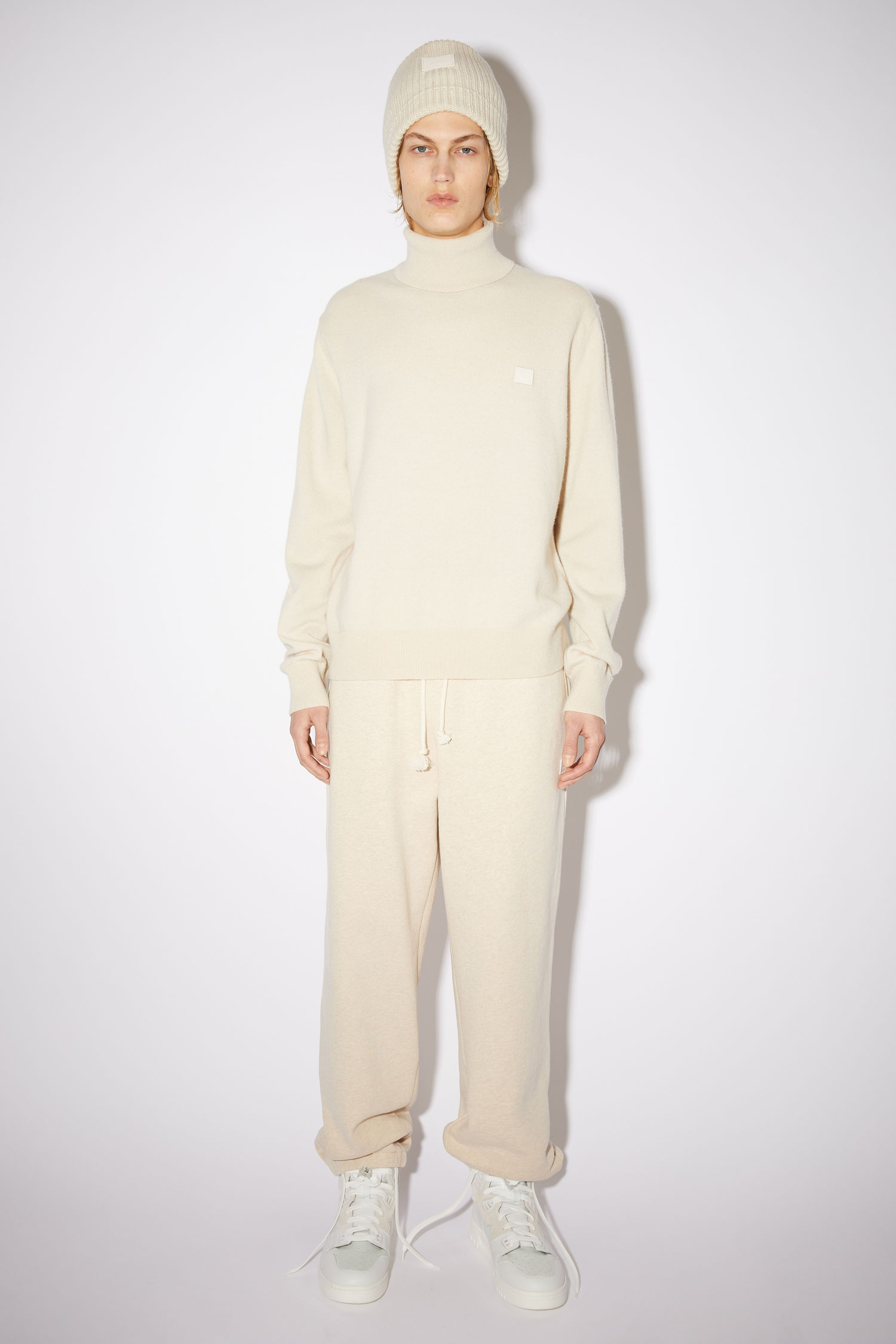 beige turtlenecks