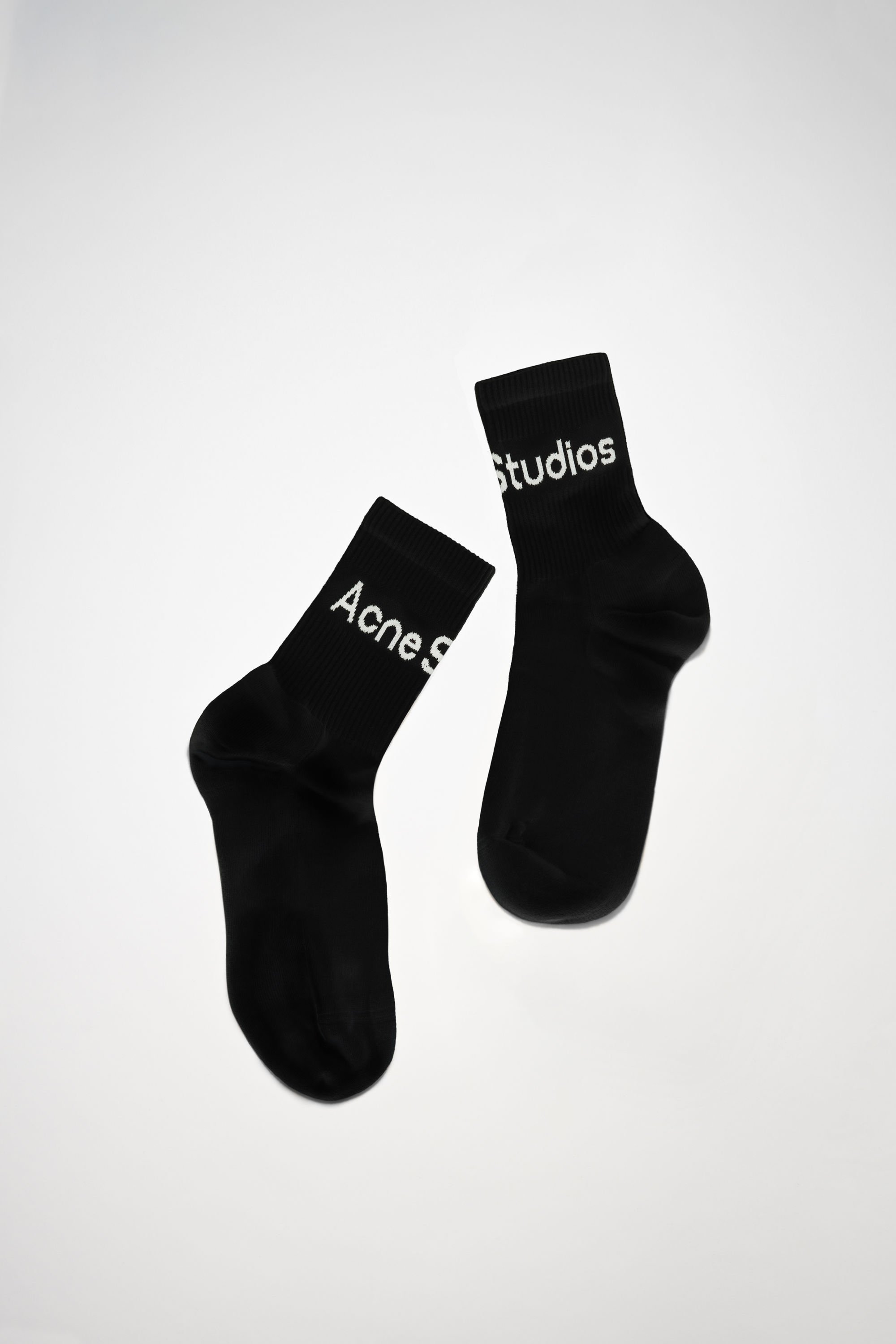 Acne Studios Ribbed Logo Socks In Black Satin,grey